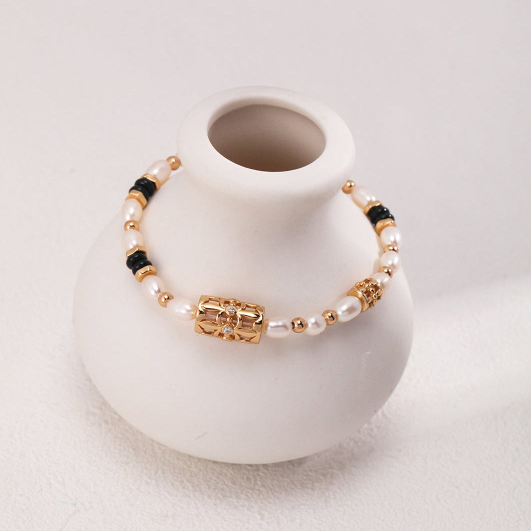 Bracelet de perles d'or et d'agate noire